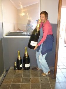 me lifting a bottle at Simonsig Stellenbosch
