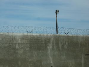 barbed wire on a wall of the prison Robben Island