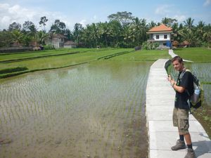 me in front of a house and rice terraces Ubud