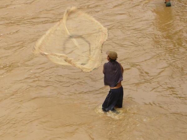Local fisherman in the river