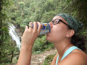 Meggie drinking a beer on the trail