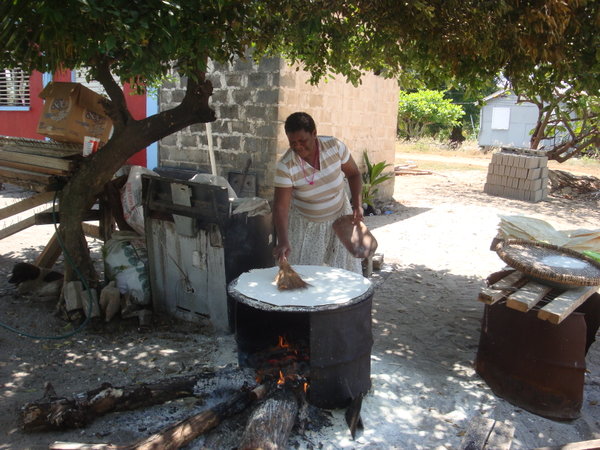 Local woman making taro bread