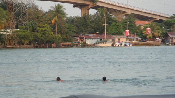 Swimming across Rio Dulce