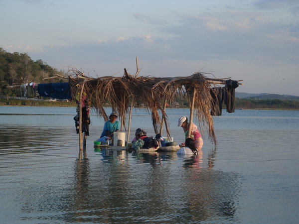 Women doing laundry in the lake