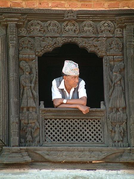 Nepali man in nicely carved window