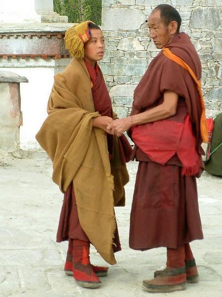 Young monk greeting his elder