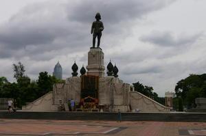 a statue of some dude with a big hat at Lumphini Park