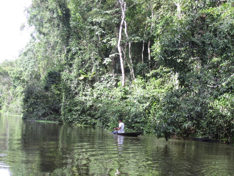 A local man paddling down the river