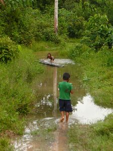 Local children playing in the water