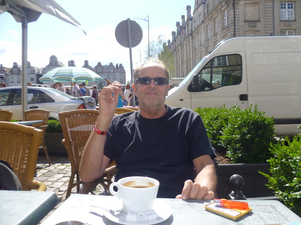Bill attempts an unconvincing pose of sophistication over a cafe noir....