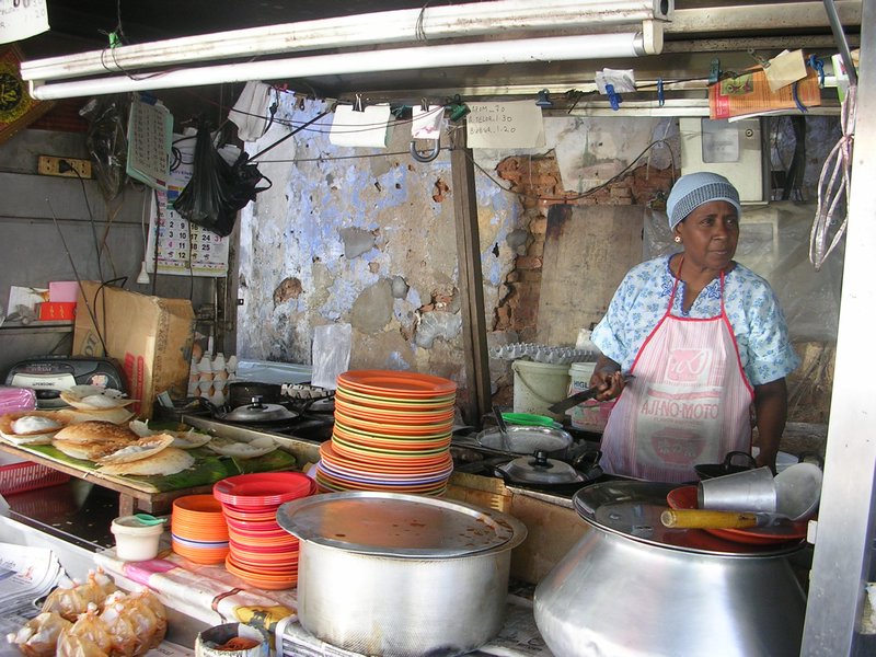 Lady selling apom & teh tahrik