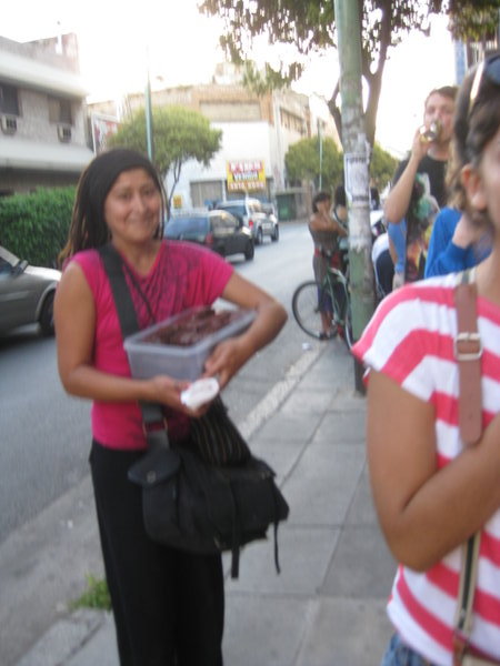 One of the many selling cakes while lining up for La Bomba De Tiempo