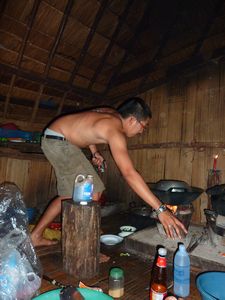 My tourguide 'off' cooking us dinner at the lahu village