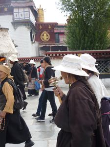 Tibetans with their prayer wheels