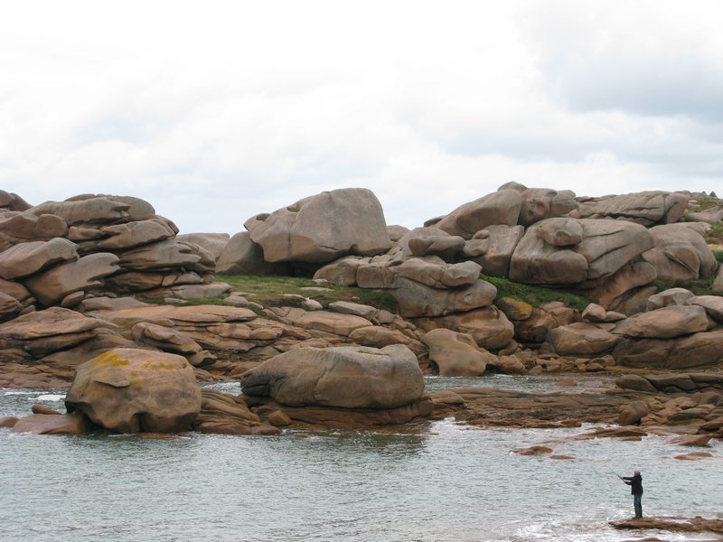 Lots of cool pink granite (with man fishing)