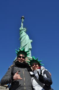 Two crazy people in front of Statue of Liberty