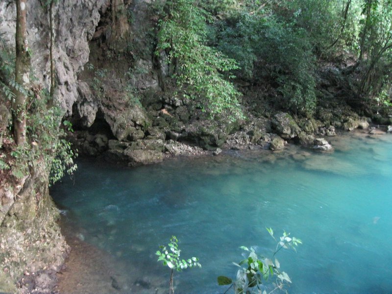 The Lanquin river flows directly from the cave