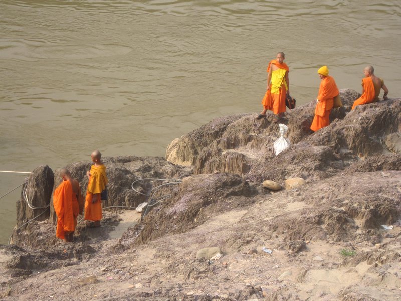 Buddhist monks kicking it riverside