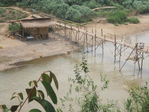 bamboo bridge that people ride motorcycles over