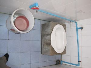 a typical SE asian bathroom...the bucket doubles as flusher and bidet