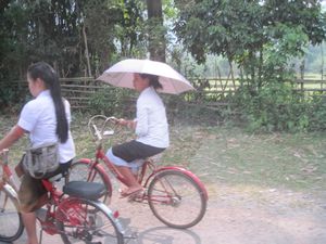 When the schools let out, the roads are absolutely covered in girls in uniforms riding bikes with one hand, parasol in the other...its surreal