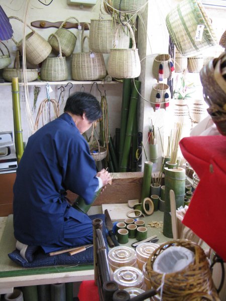Shop Owner forming bamboo