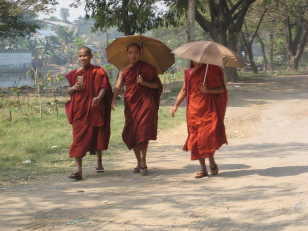 monks walking down the street
