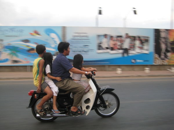 4 people on a motorbike..the most I've seen is 5!