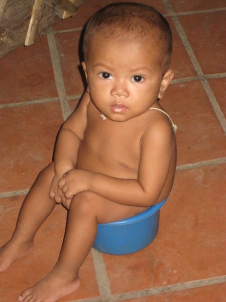 one of the kids at the orphanage...not quite sure why he was sitting in a pale!