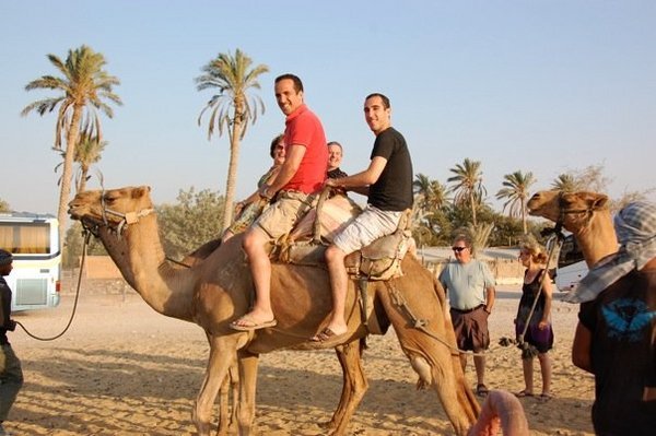 Camel riding in the desert
