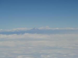 Fist view of Ecuador.. volcano poking through the clouds