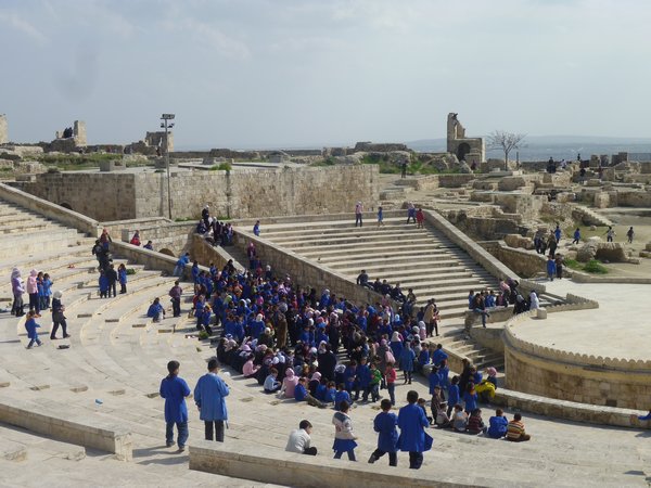 Schoolkids at theatre of citadel in Aleppo