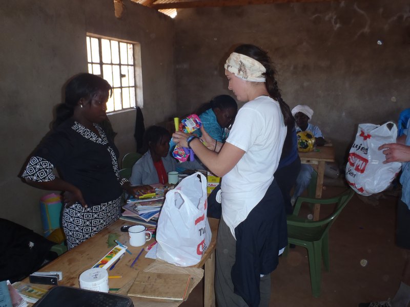 Lauren Giving the Teachers at Osupuko New Supplies...