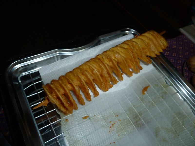 Amazing fried potatoe slices on a stick
