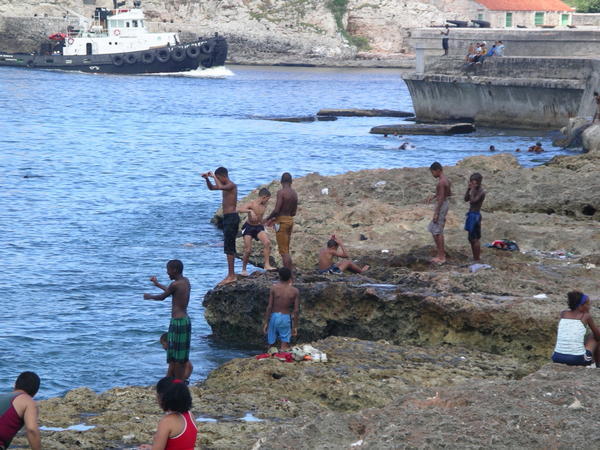 Kids swimming at the Malecon