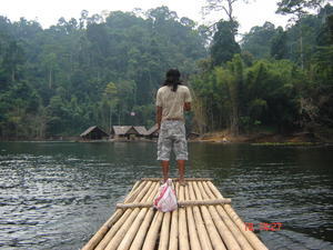 Ou our guide taking us back on the Bamboo Raft