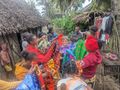 Jane surrounded by villagers near Manakara wanting to sell their wares
