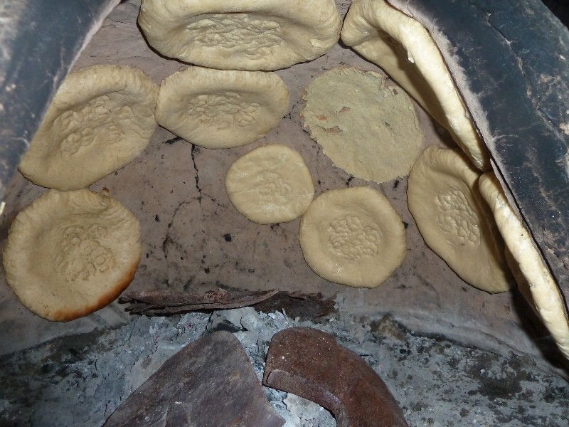 Bread cooking in Fahima's tandoor oven