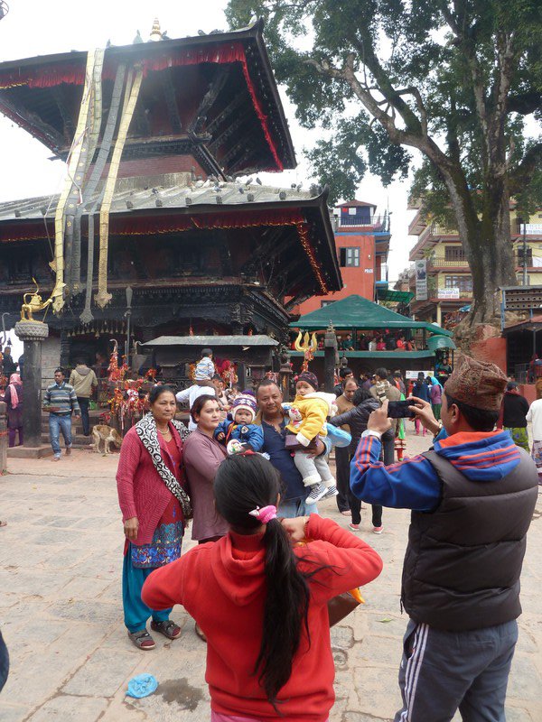A family taking their picture outside the Manakamana temple
