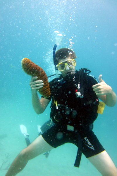 me holding a sea slug