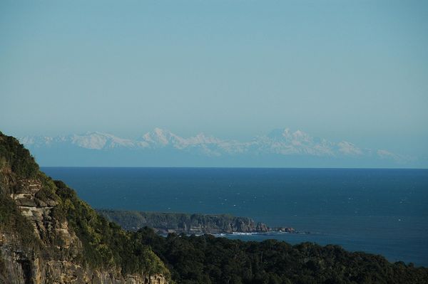 First sight of the Te Nikau peninsular with the Southern Alps over 100kms away to the south