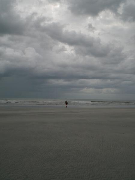 Andrea on the deserted moody beach at Jeri