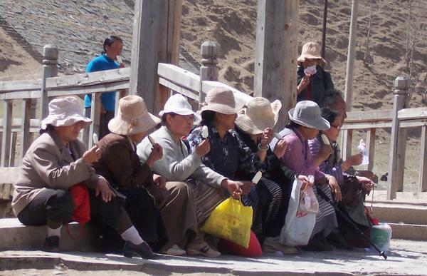 Tibetan ladies take time out for a refreshing ice-block