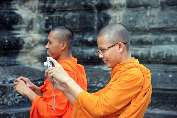 Monks Taking Photos At Angkor Wat