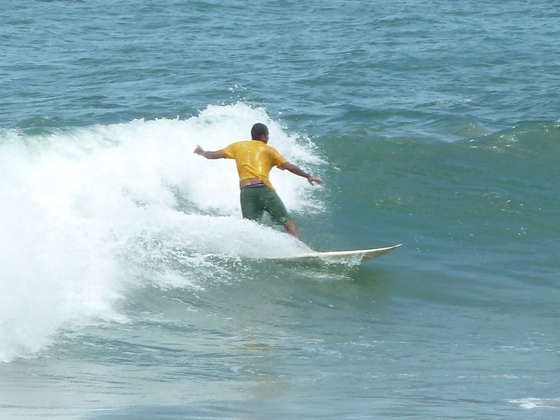 G shows locals how to surf