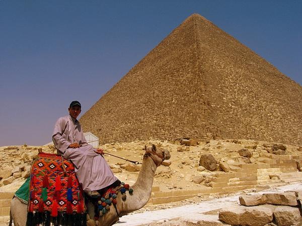 Riding a camel in front of the Great Pyramid