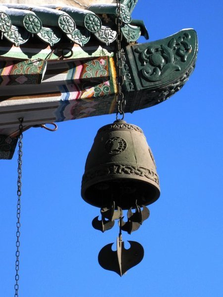 traditional bell over blue sky