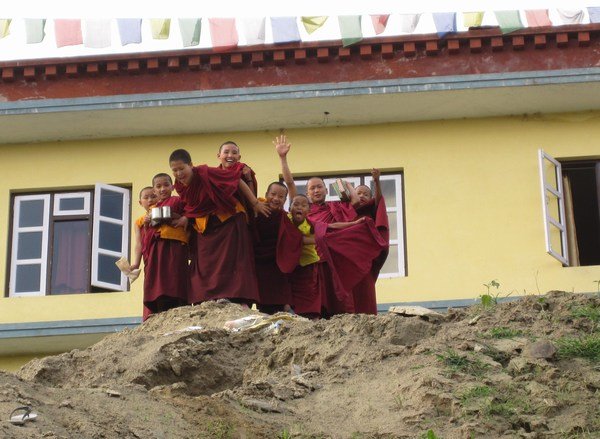 Young monks laughting & smiling