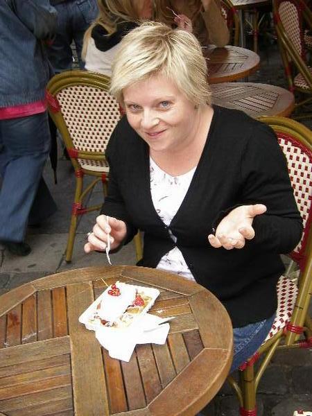Sarah enjoying a Belgian specialty gaufres (waffle)
