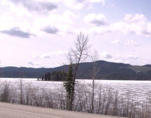 AK1 May13 semi-frozen lake bordering highway